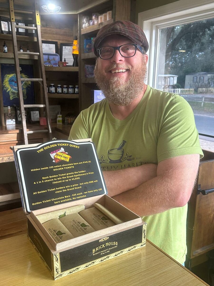 Terry behind the counter inside Healthy Habits Apothecary