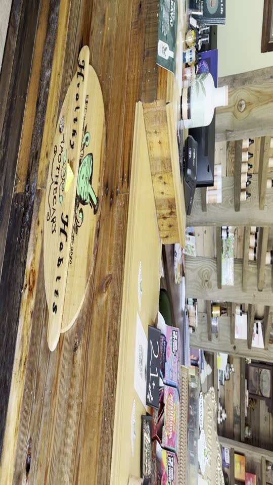Healthy Habits Apothecary product shelves and local shop details